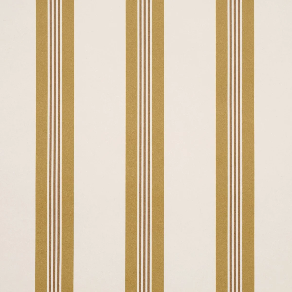 Close view of Schumacher Chatham Stripe in Ochre showing the gold pinstripe detail