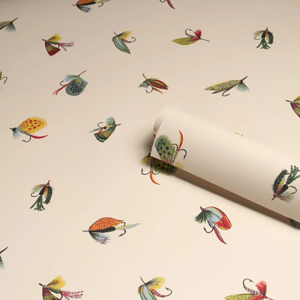 Schumacher Fly Fishing wallpaper roll in Ivory, colorful feather flies on a pale ground