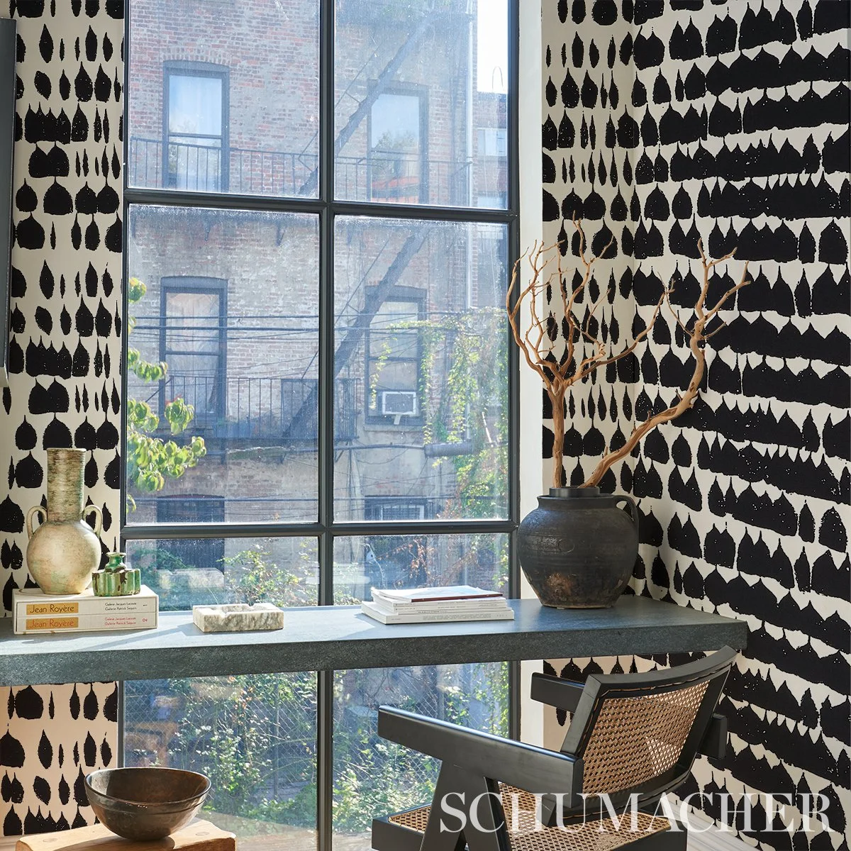 Schumacher Queen of Spain Black wallpaper in a home office with a desk under a tall window