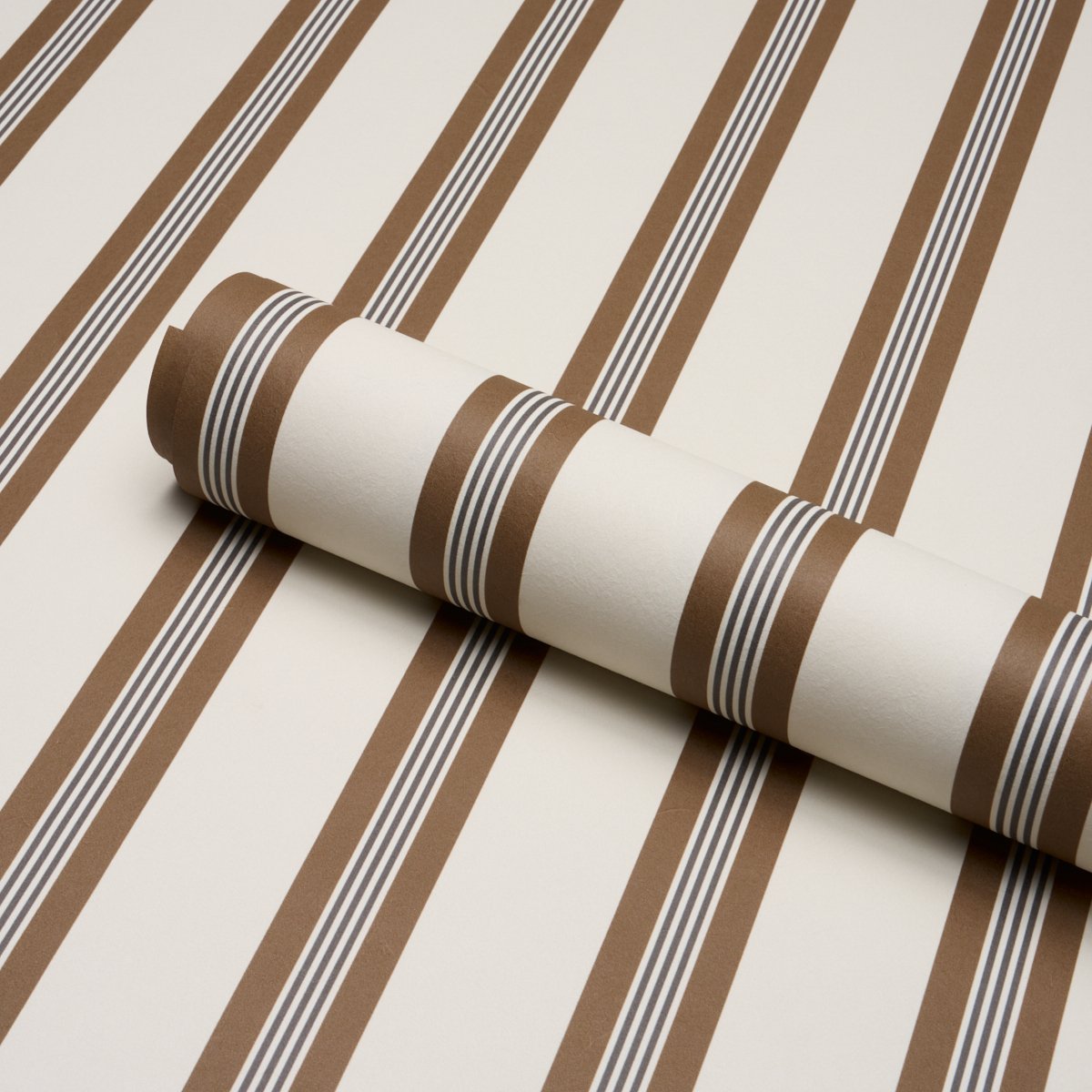 Schumacher Chatham Stripe wallpaper in Umber, brown and cream stripe roll