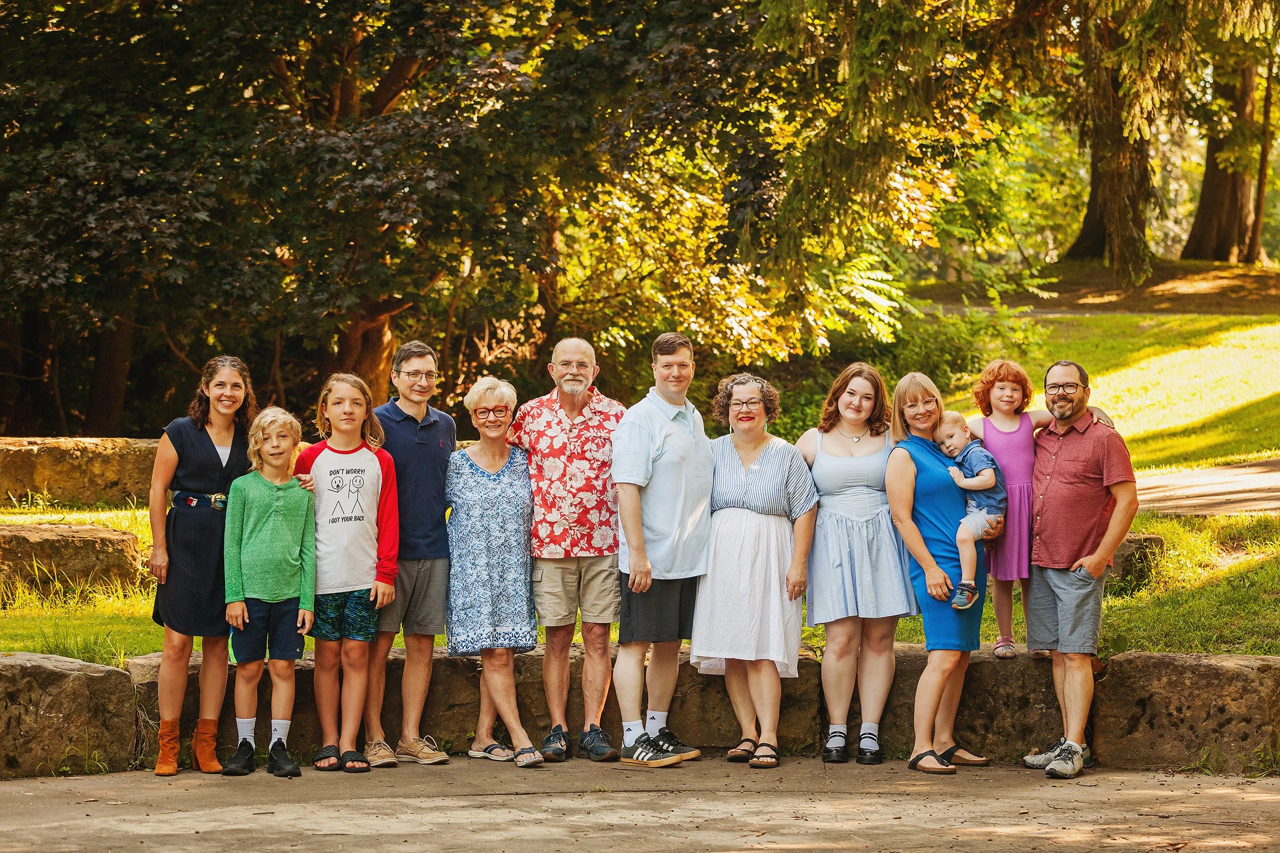Large family group photo with grandparents outdoors in the sunshine in Northeast Ohio