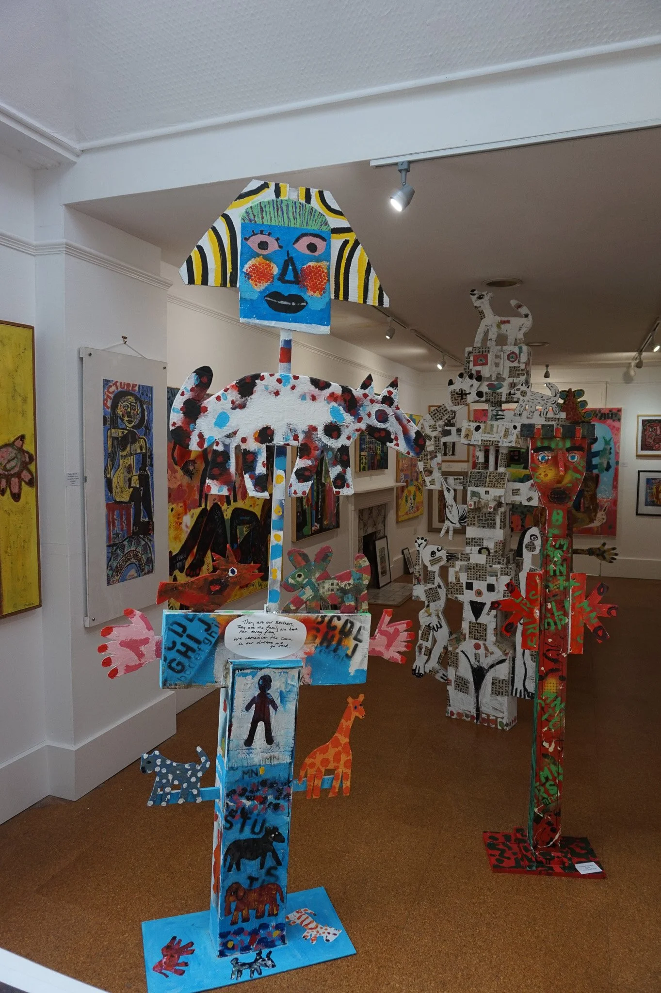 10. figures in exhibition. card,wood and paint.jpg