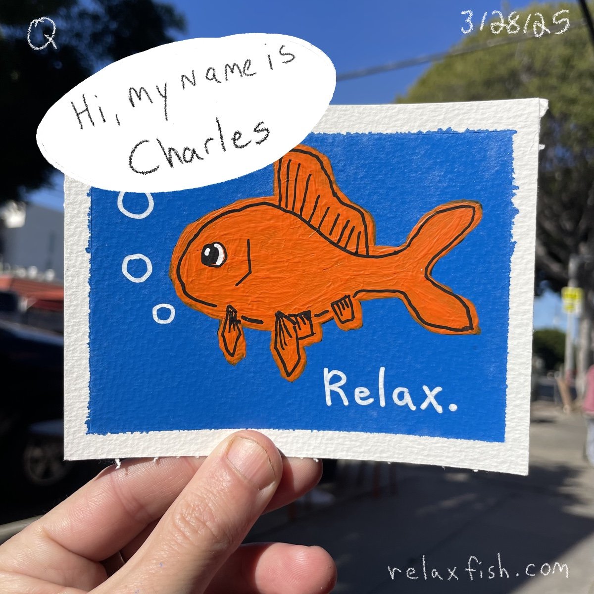 A colorful illustrated card featuring an orange fish with a blue background. The fish has large eyes and fins, and the words 'Relax.' are written on it. There is a speech bubble saying, 'Hi, my name is Charles.' The card is being held outdoors with a