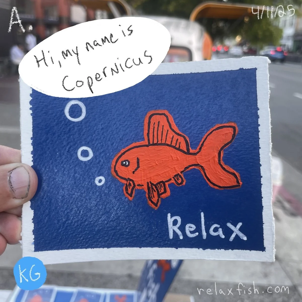 A colorful drawing of a red fish swimming among bubbles against a dark blue background, with the words 'Relax' written below. A speech bubble says, 'Hi, my name is Coppernicus.' This appears to be a name tag or sign for a relaxation or calming activi