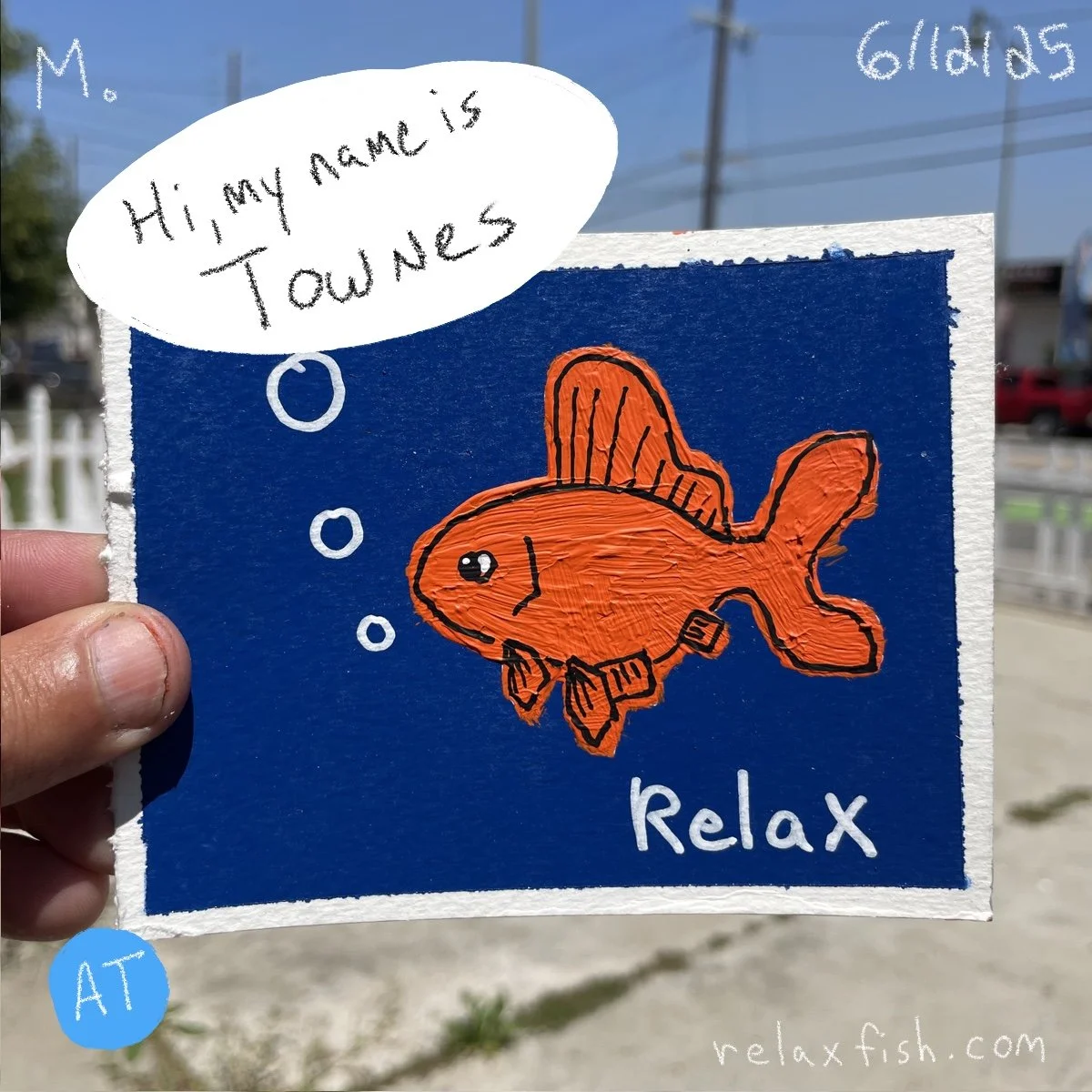 A hand holding a square sign with a blue background and an orange fish illustration. The fish is wearing a collar and has the word 'relax' written beneath it. A speech bubble says, 'Hi, my name is Townes.' In the lower left corner, there is a blue ci
