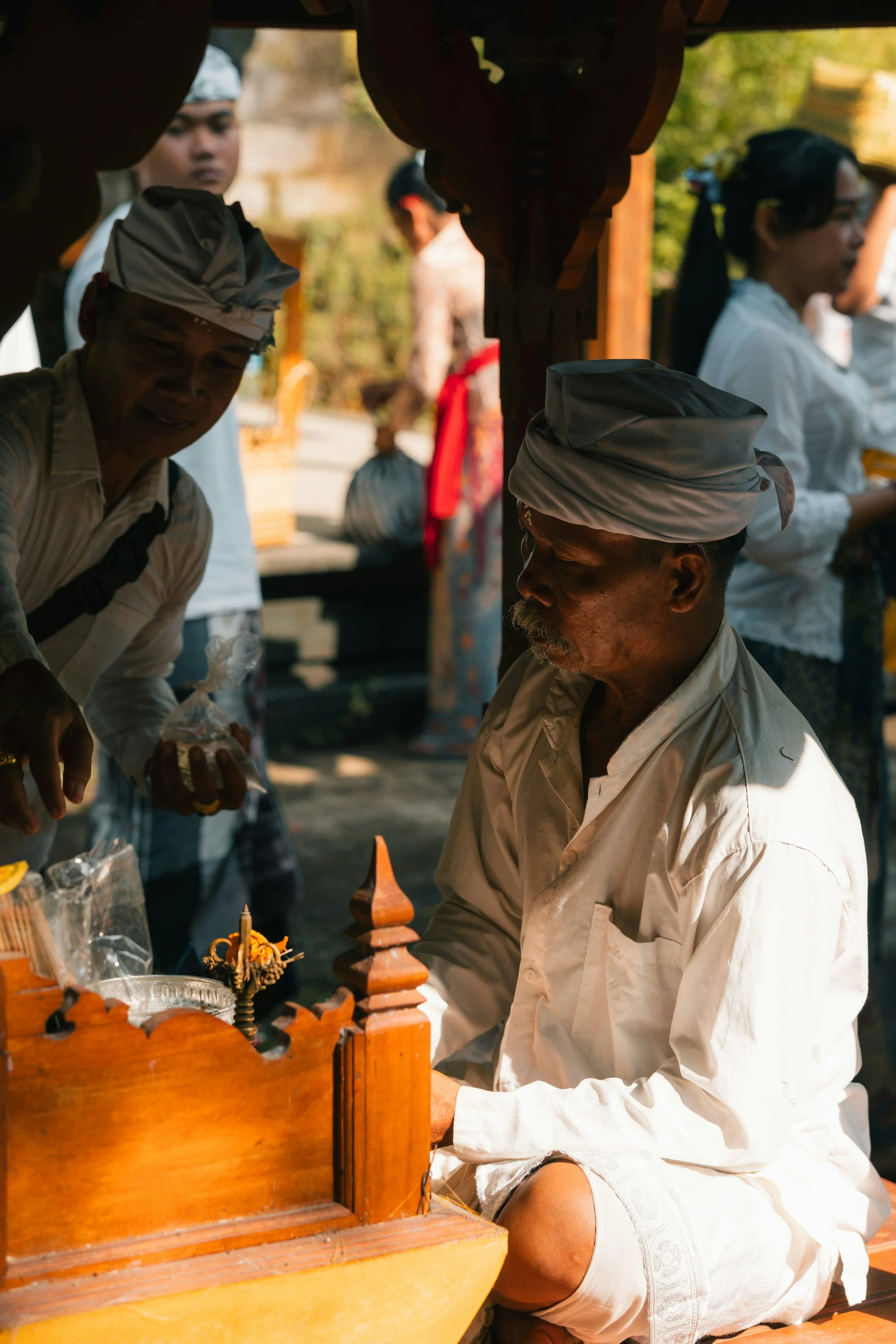A local Indian seller showing his products to an interested potential buyer.