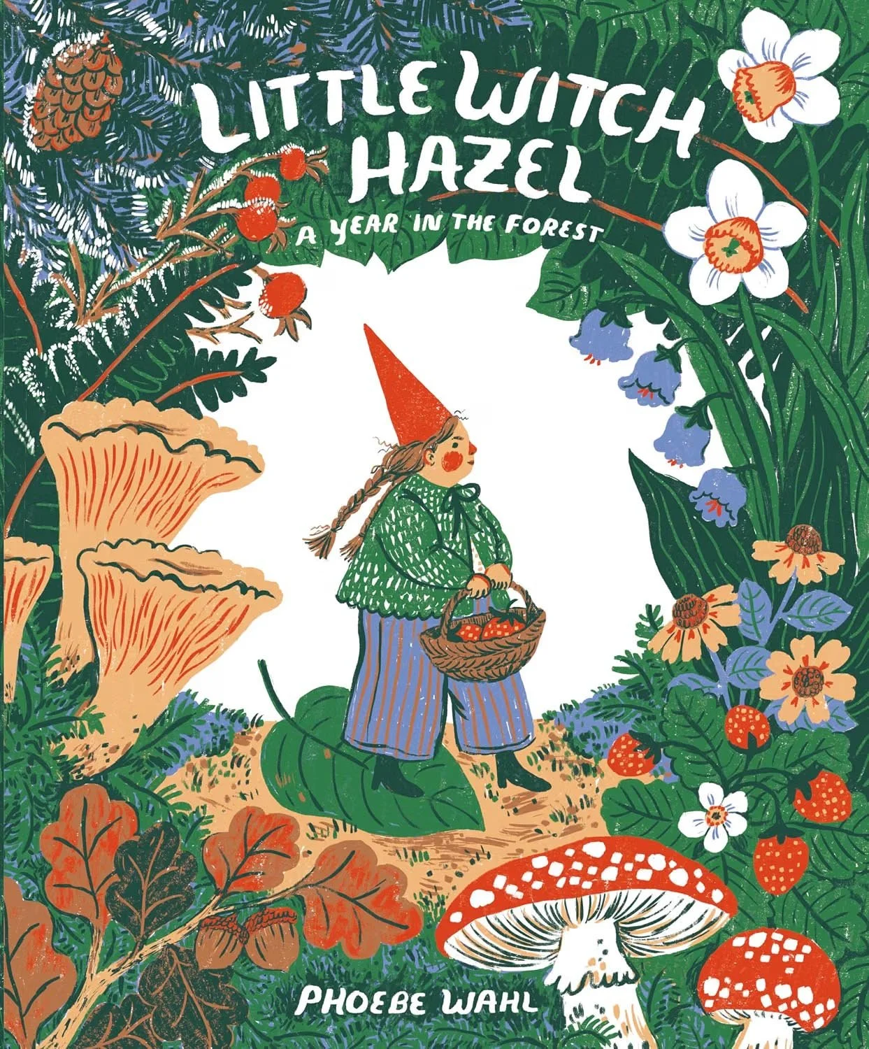 A colorful illustrated book cover titled 'Little Witch Hazel: A Year in the Forest' by Phoebe Wahl. It features a young girl dressed as a witch, wearing a red hat, green sweater, and striped pants, carrying a basket of berries. She is in a forest surrounded by large mushrooms, various flowers, berries, leaves, and pinecones, creating a whimsical and enchanted atmosphere.