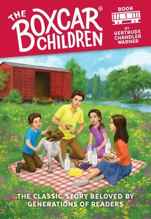 The cover of the book 'The Boxcar Children' showing three children and a dog having a picnic outdoors, with a red barn and green trees in the background.