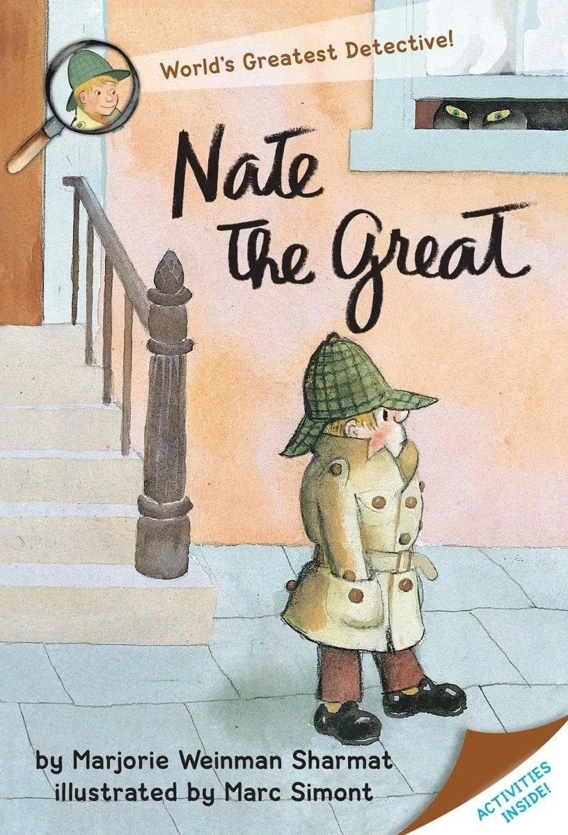 Cover of a children's book titled "Nate the Great" with a detective theme. It features a young boy in a trench coat and hat, standing on a sidewalk, with a magnifying glass showing his face. There is a window with two eyes peering out and a staircase leading up to a building. The book is by Marjorie Weinman Sharmat, illustrated by Marc Simont, and includes activity pages inside.