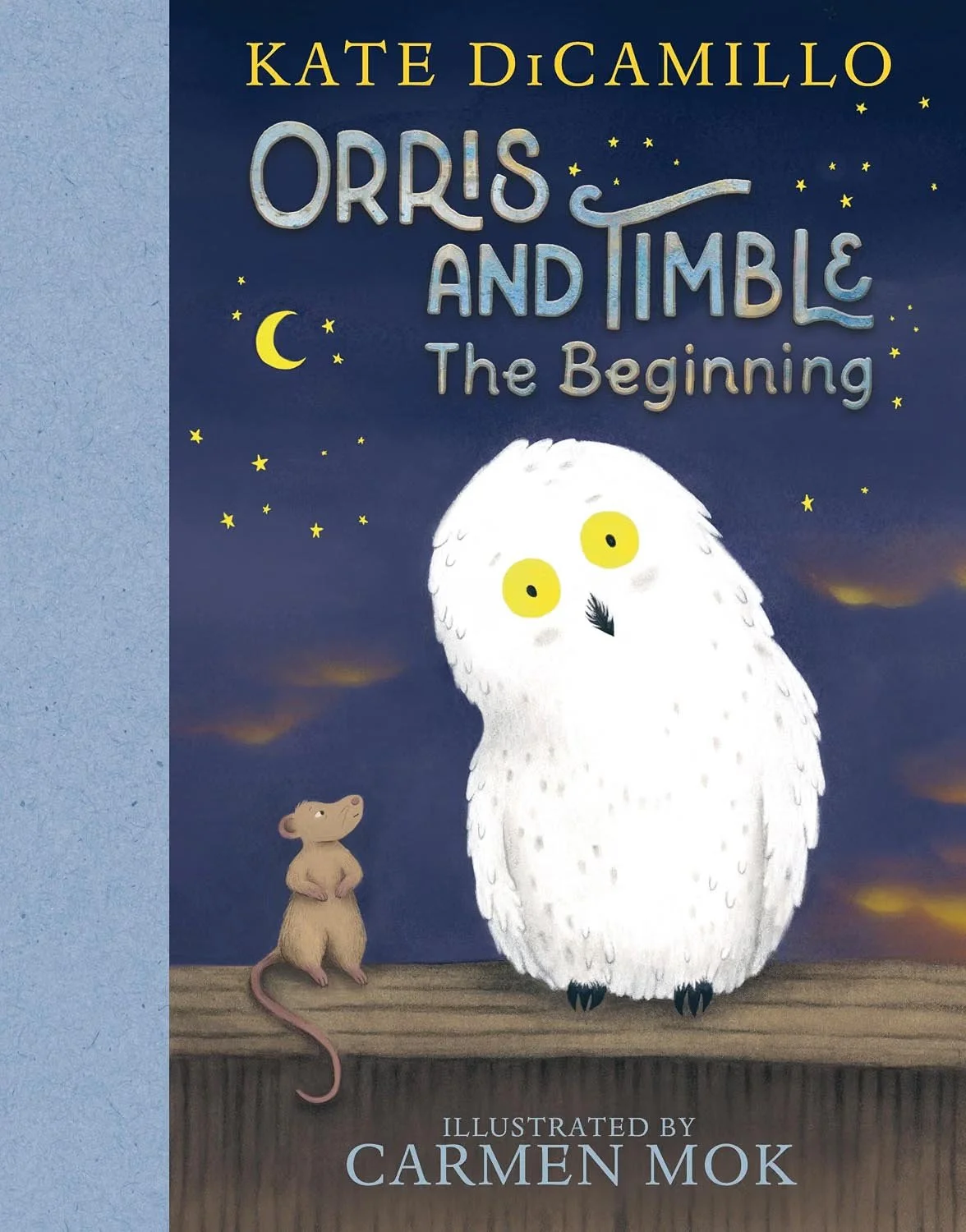 Book cover for "Orris and Tumble: The Beginning" by Kate DiCamillo, illustrated by Carmen Mok. Features an owl with yellow eyes and a small brown mouse standing on a wooden surface against a night sky with stars and a crescent moon.