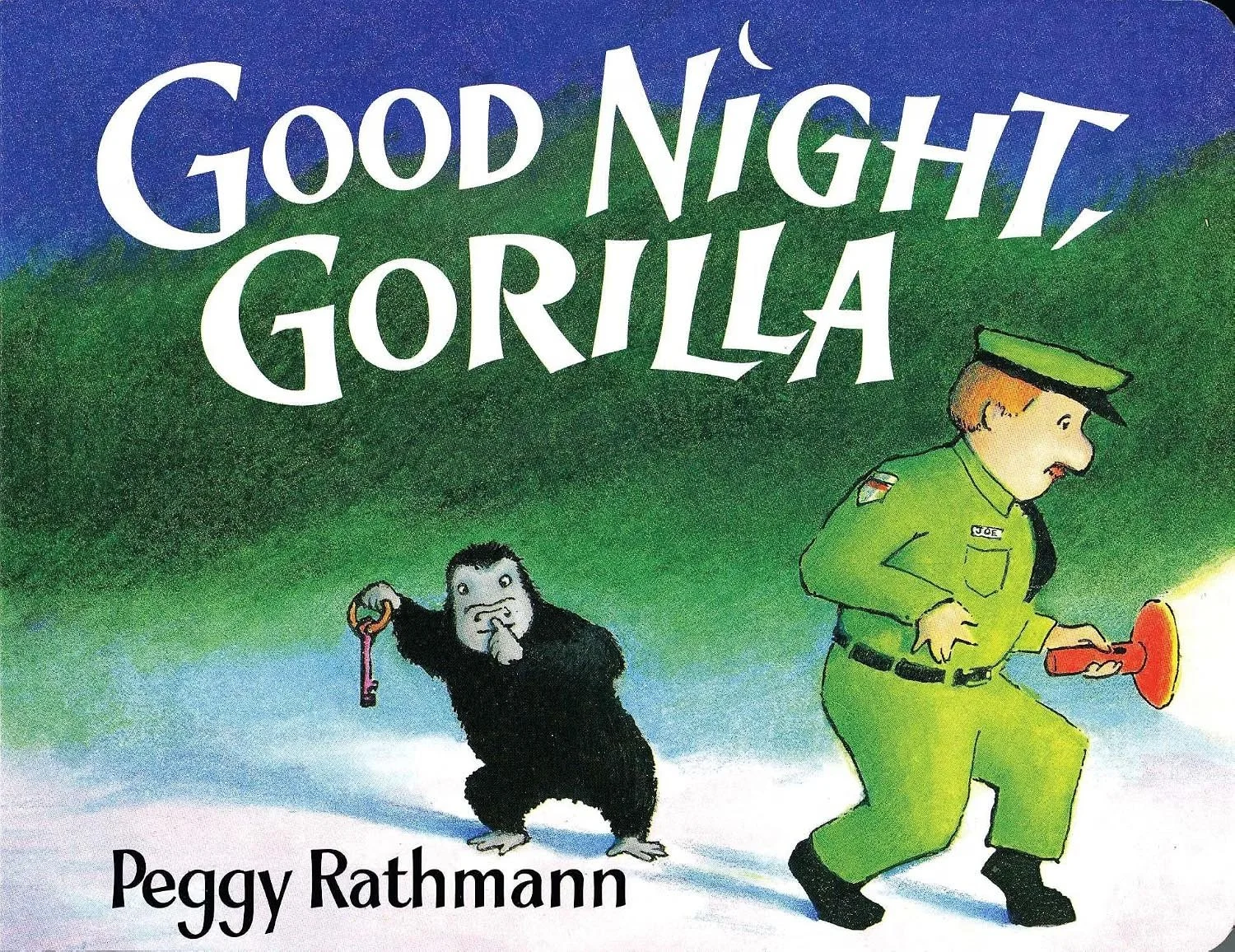 Book cover titled 'Good Night, Gorilla' by Peggy Rathmann, featuring a door guard in green uniform holding a flashlight and a gorilla holding a key, with a background of green and blue.