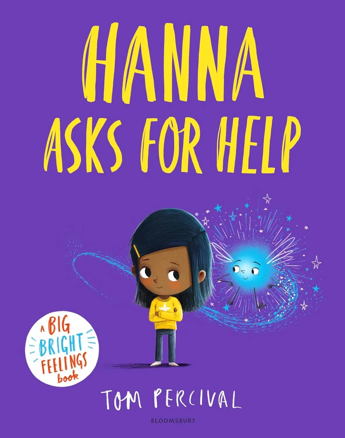 Book cover titled "Hanna Asks for Help" by Tom Percival. Features a cartoon girl with dark hair and a yellow sweater, and a smiling blue star surrounded by sparkles and galaxy-like swirls on a purple background.
