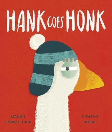 Cover of a children's book titled 'Hank Goes Honk' featuring a cartoon duck wearing a blue striped winter hat, set against a red background.