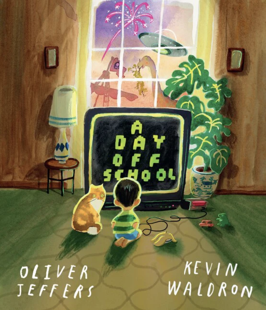 A colorful illustration of a child and a cat sitting on a green carpet in front of a television displaying the words 'A DAY OFF SCHOOL.' There is a large potted plant on the right, a small side table with a lamp on the left, and a window with curtains showing fireworks and animals outside. The image has the names Oliver Jeffers and Kevin Walron written at the bottom.