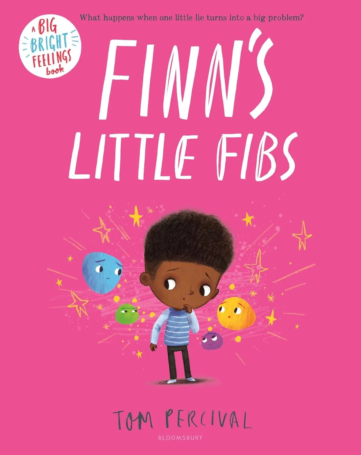 Book cover for "Finn's Little Fibs" by Tom Percival, with a pink background and an illustration of a young boy with dark skin and curly hair, surrounded by animated, colorful planet-like characters and stars.