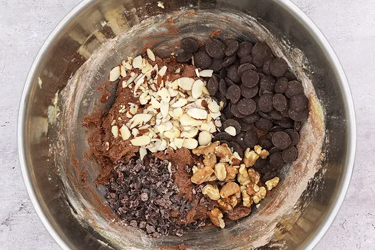 Dark chocolate chips, cacao nibs, walnuts, and almonds added to cookie dough