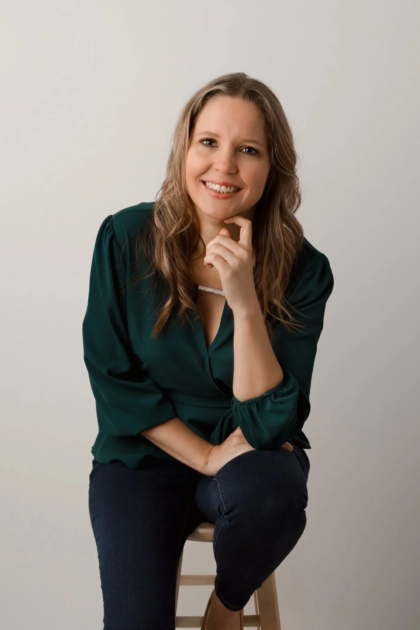 Kayla Hennick (owner of Sun-kissed Memories) posing for her headshot.