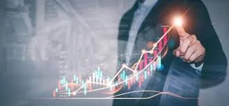 Person in business suit pointing at digital upward-trending stock graph and chart.