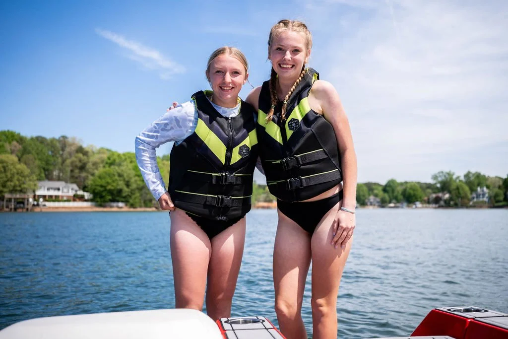 two girl on boat on lake norman, nc