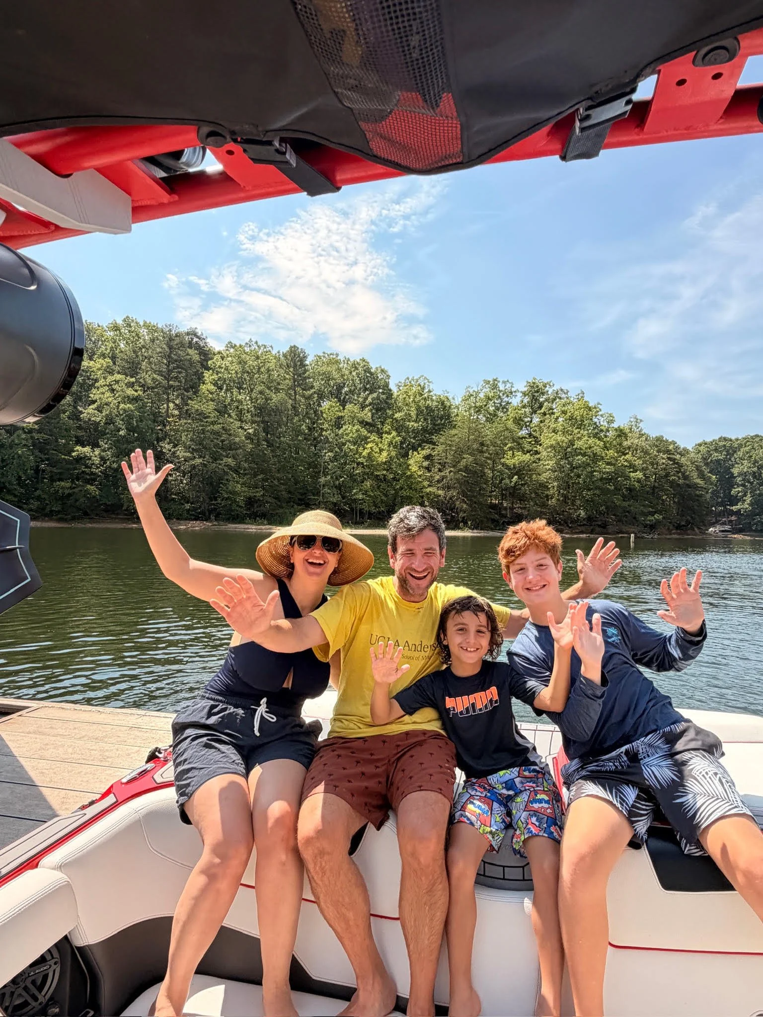 A young family enjoys a day on the lake with Surf Wake Ski on Lake Norman.