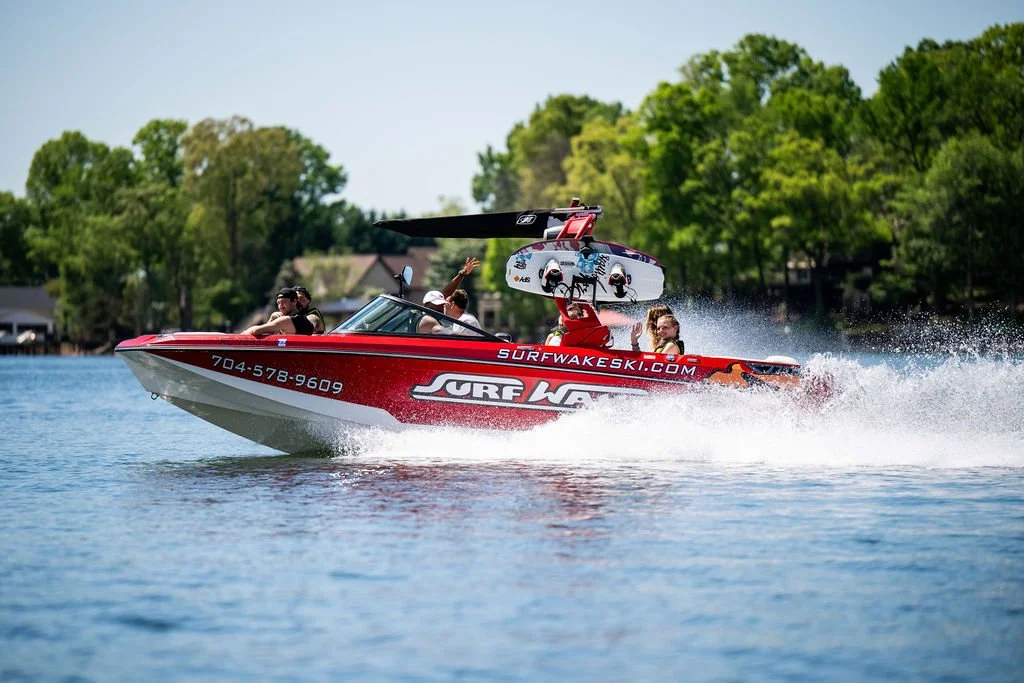 Surf, Wake, Ski boat on the water with a group