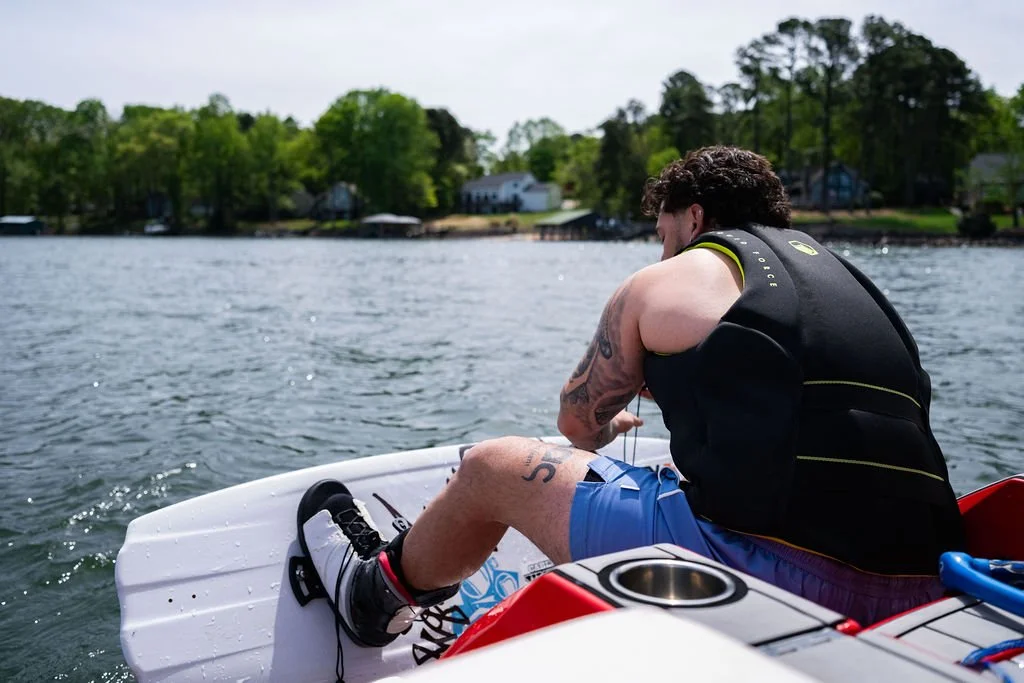 Man getting ready to wakeboard on Lake Norman during a private session with Surf Wake Ski