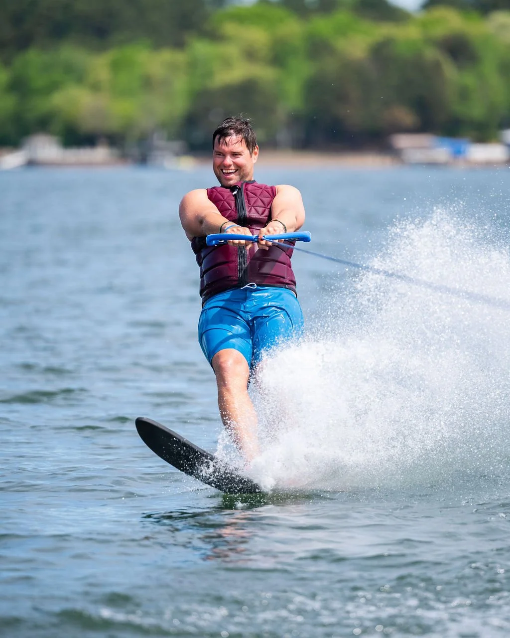 Smiling man on water skis during a private lesson on Lake Norman