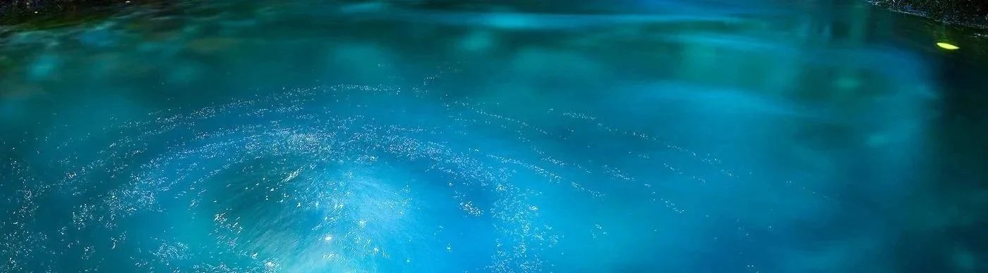 Image of bubbling spring water with a bright blue color.