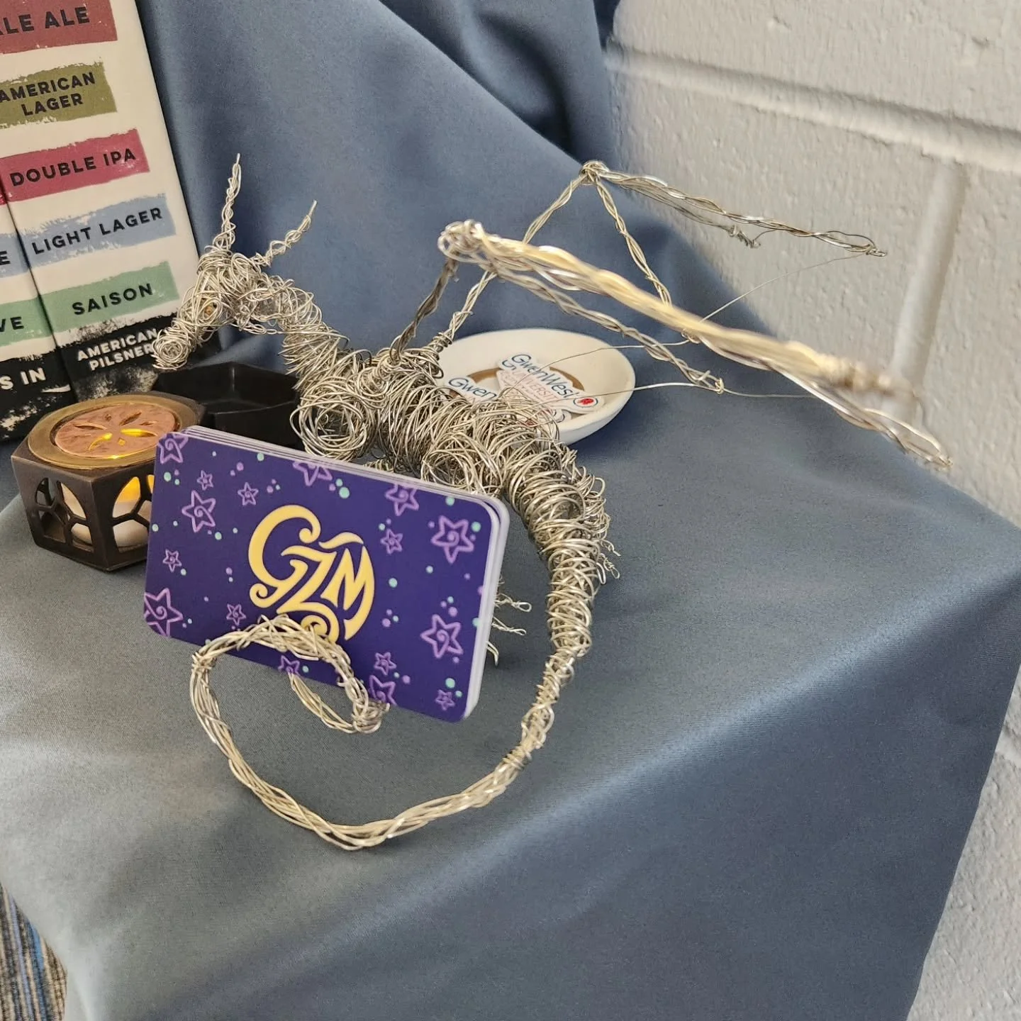 Gartholomew, my dragon business card holder. Made by hand, with love, using only wire and beads for the eyes