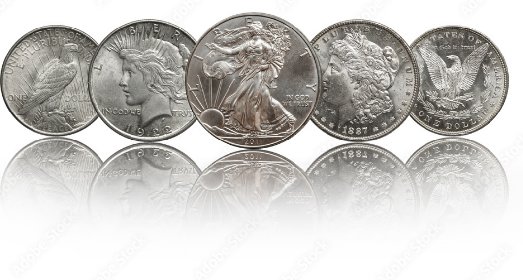 Six US coins displayed with reflection, including a half dollar, a quarter, a dime, and a nickel.