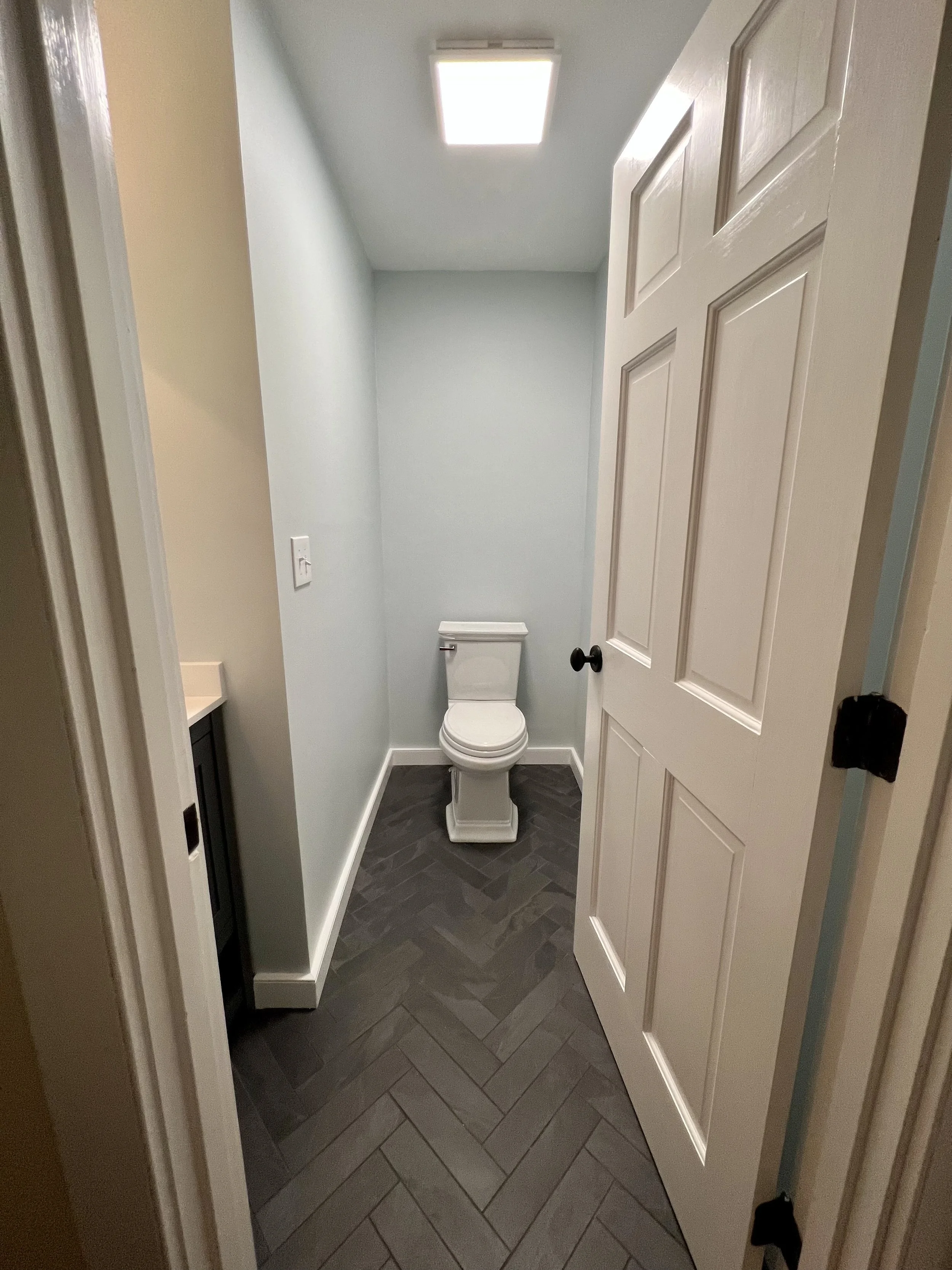 Powder room, Montauk Black slate floor tile herring bone pattern