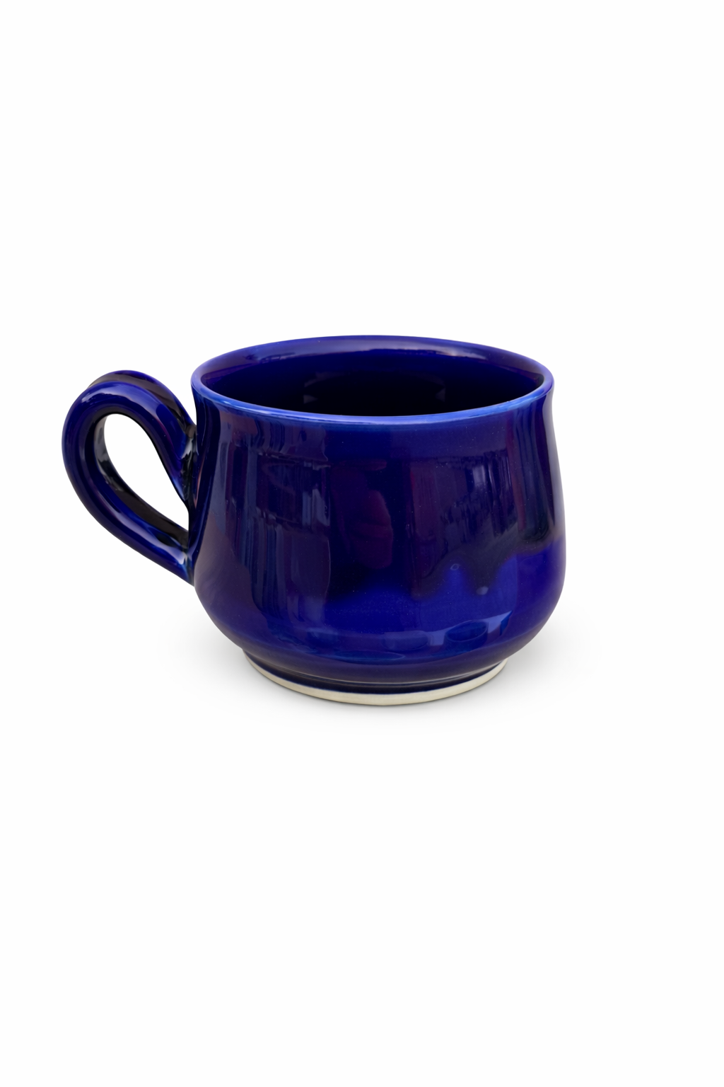 A dark blue ceramic mug with a glossy finish, empty, with a white background.