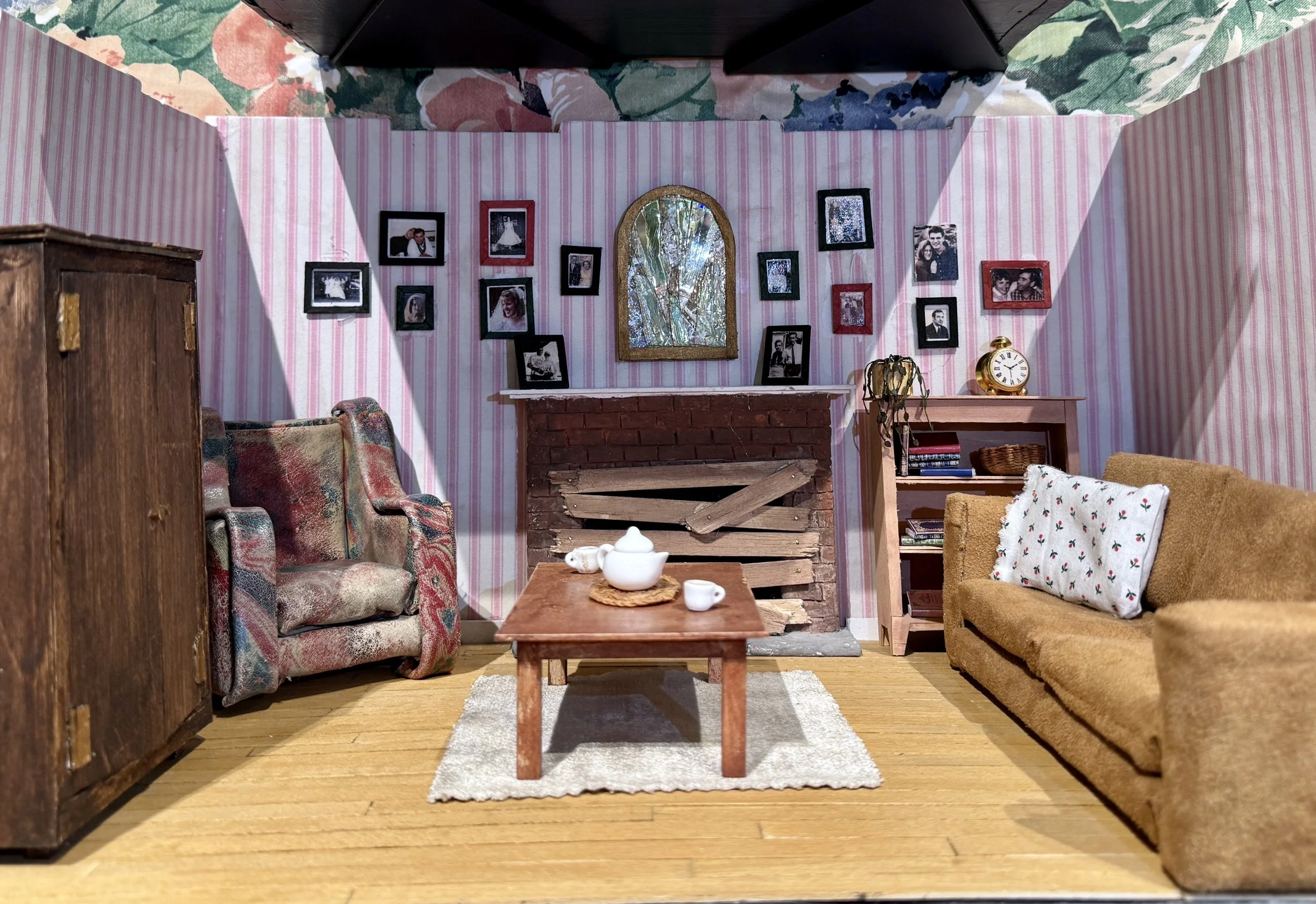 Balsa wood, acrylic paint, embroidery floss, wood glue, scrapbook paper, deconstructed suede and leather purses, foam board, wood stain, foam, printed family photos, floral wire, broken CD, paper clay, modified found objects