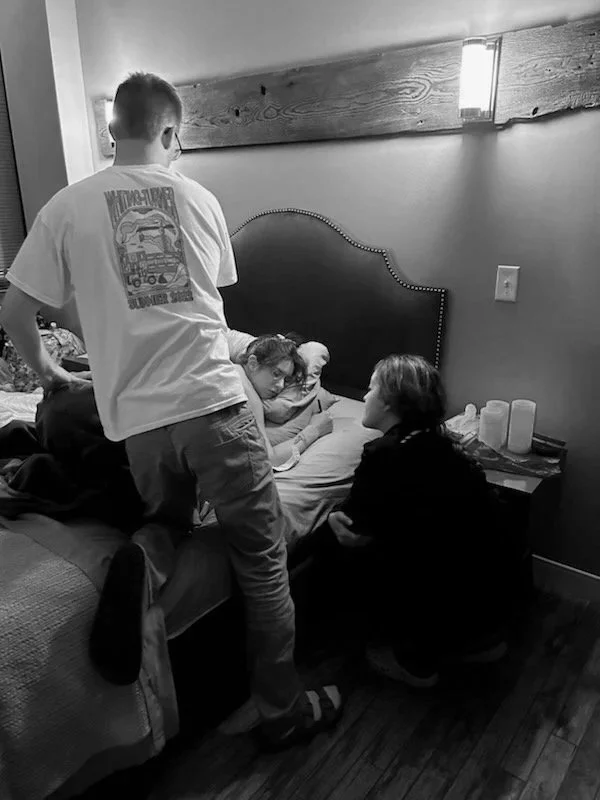 Faith-guided birth doula providing compassionate labor support and comfort measures for a mother during childbirth in Wisconsin