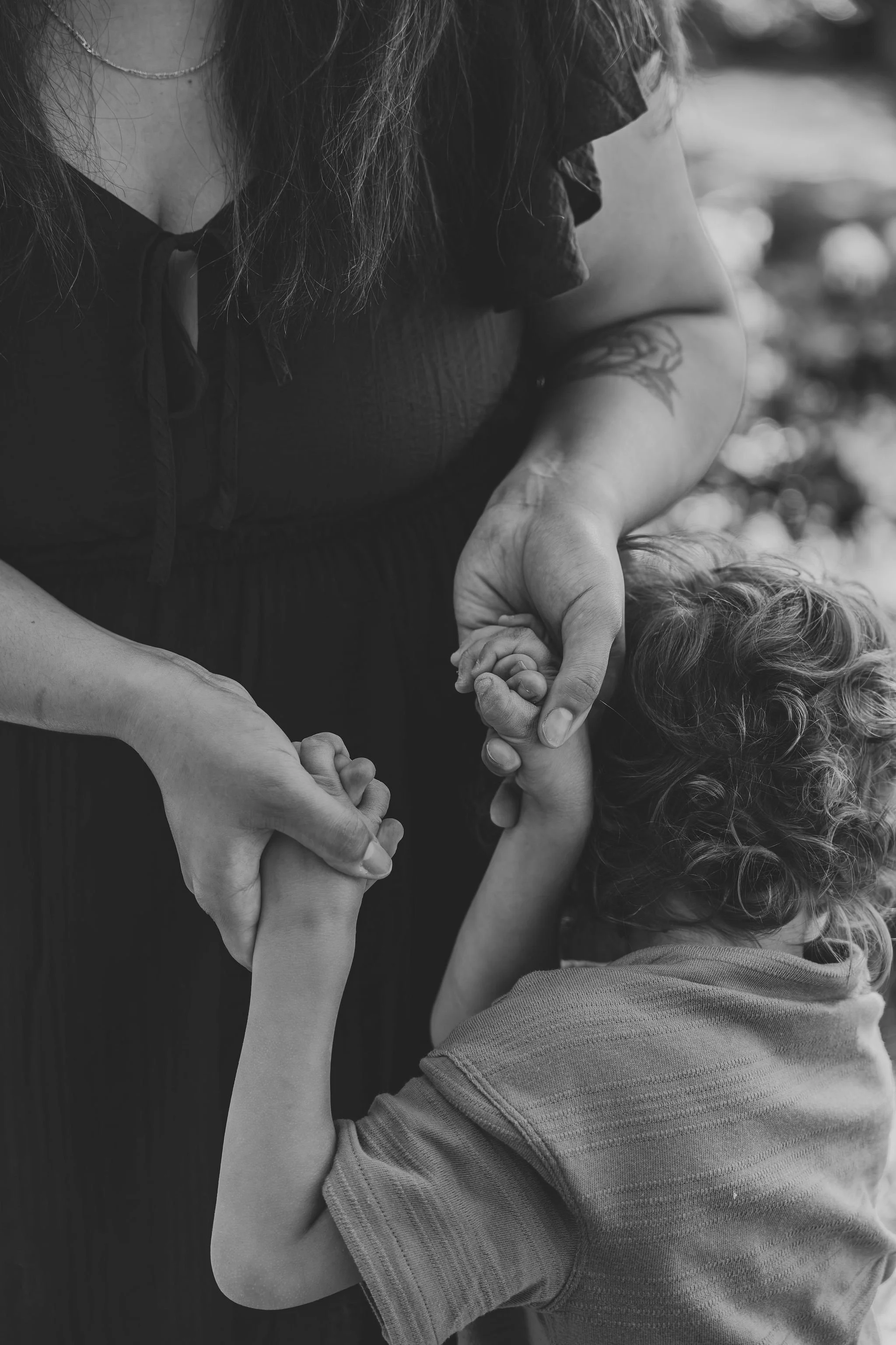 Mother embracing her child in a peaceful postpartum moment, reflecting the love, connection, and faith in God that inspire My Love Grows family support and photography.