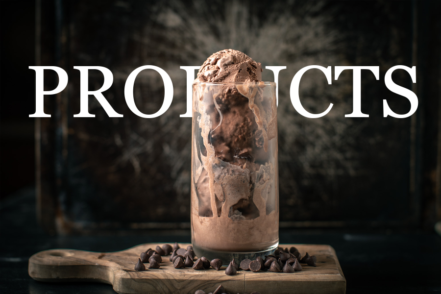 A glass of chocolate ice cream with chocolate chips on a wooden board, with the word 'PRODUCTS' overlaid in large white text.