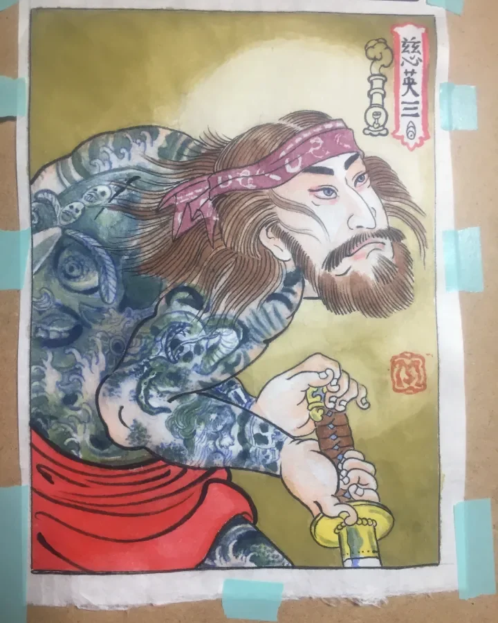 A traditional Japanese illustration of a bearded man with long hair, wearing a pink headband and red clothing, holding a sword. The background is yellowish-green with Japanese text and seals.