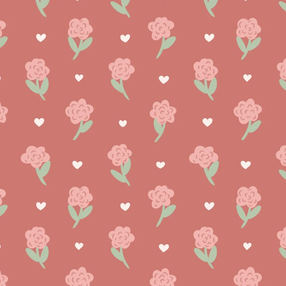 Pattern of pink flowers with green leaves and small white hearts on a pink background.