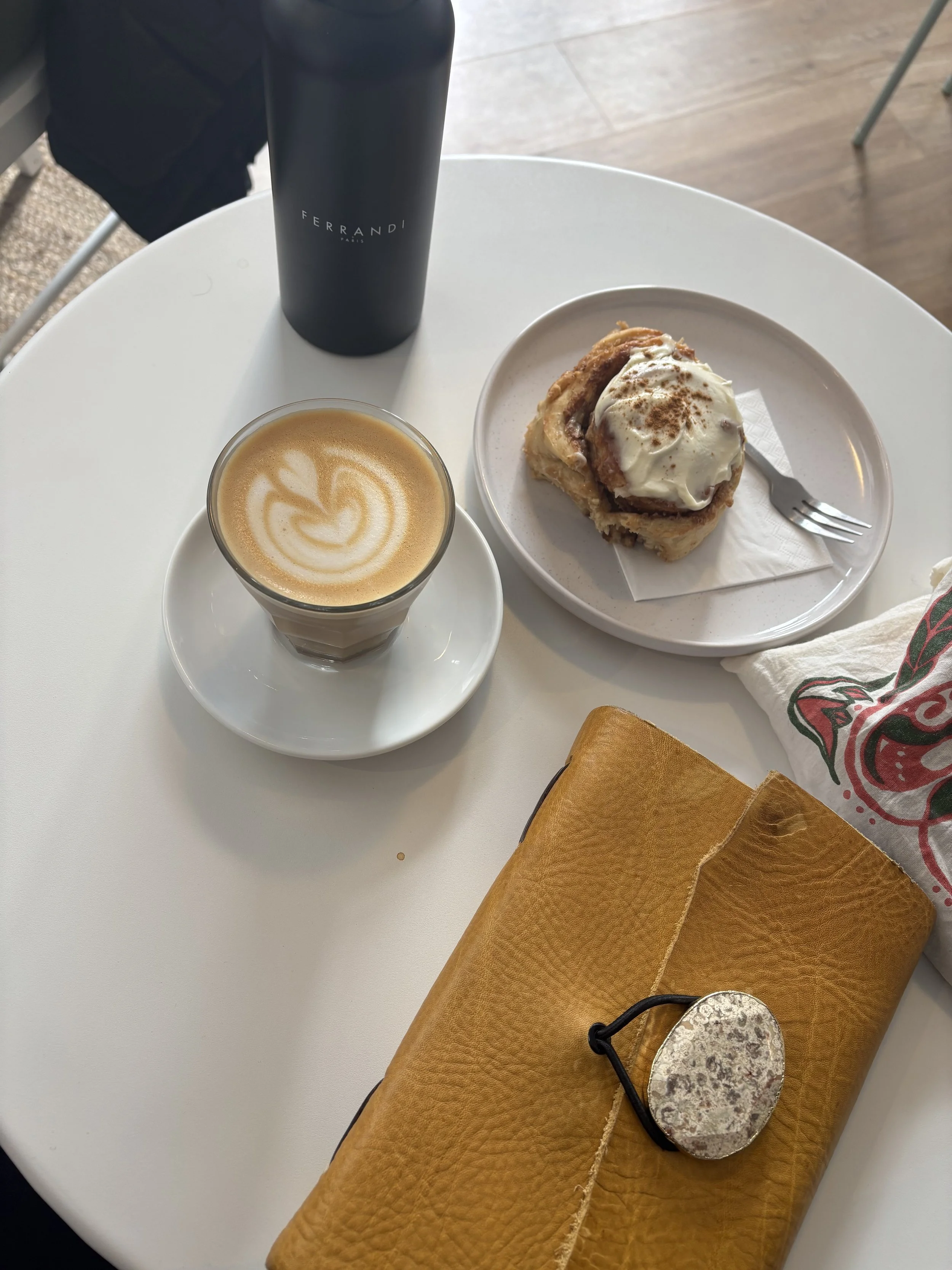 Cinnamon rolls, coffee, and notes