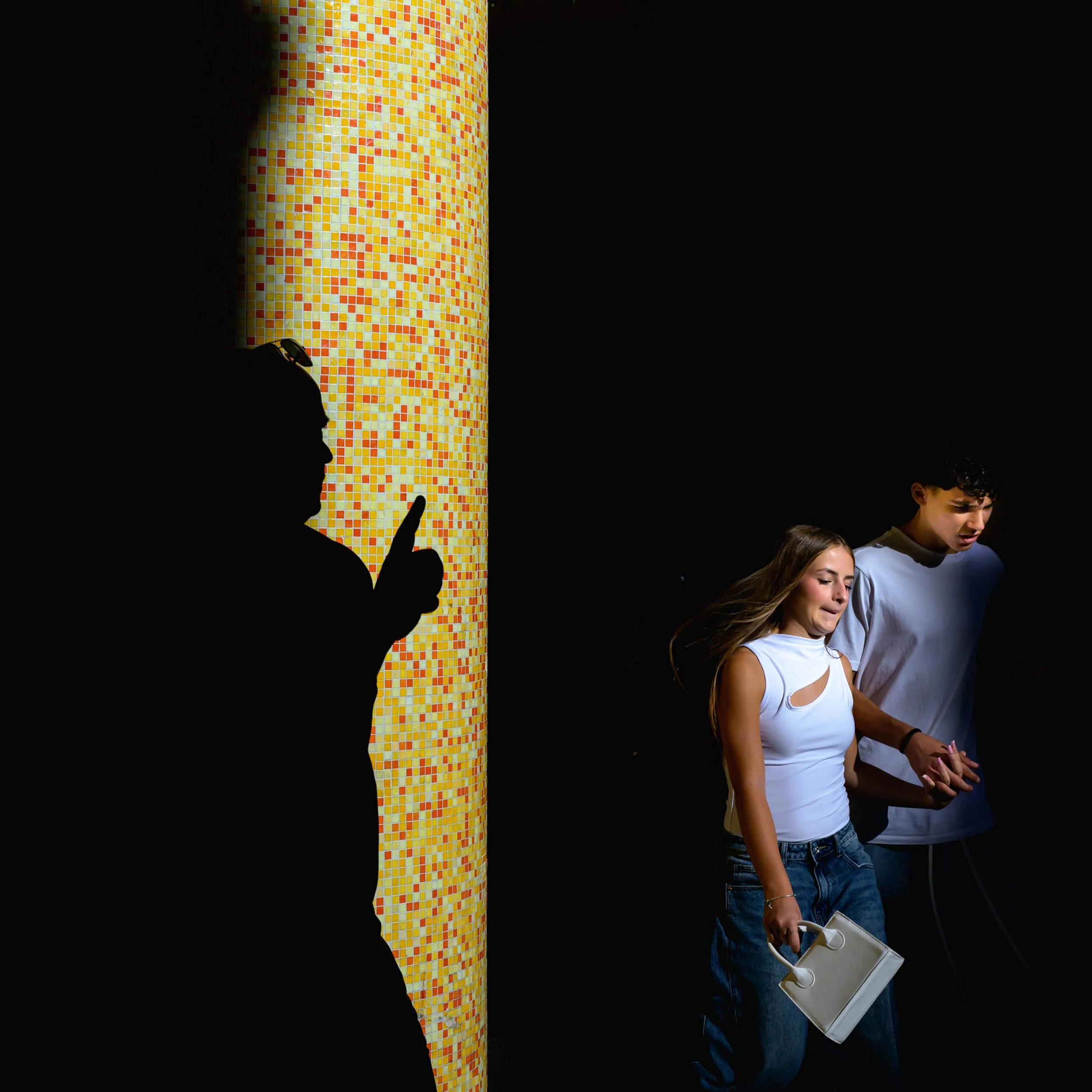 Photo by Donna Lancia in Rome a man in silhouette and a young couple in light and in the style of chiaroscuro. 