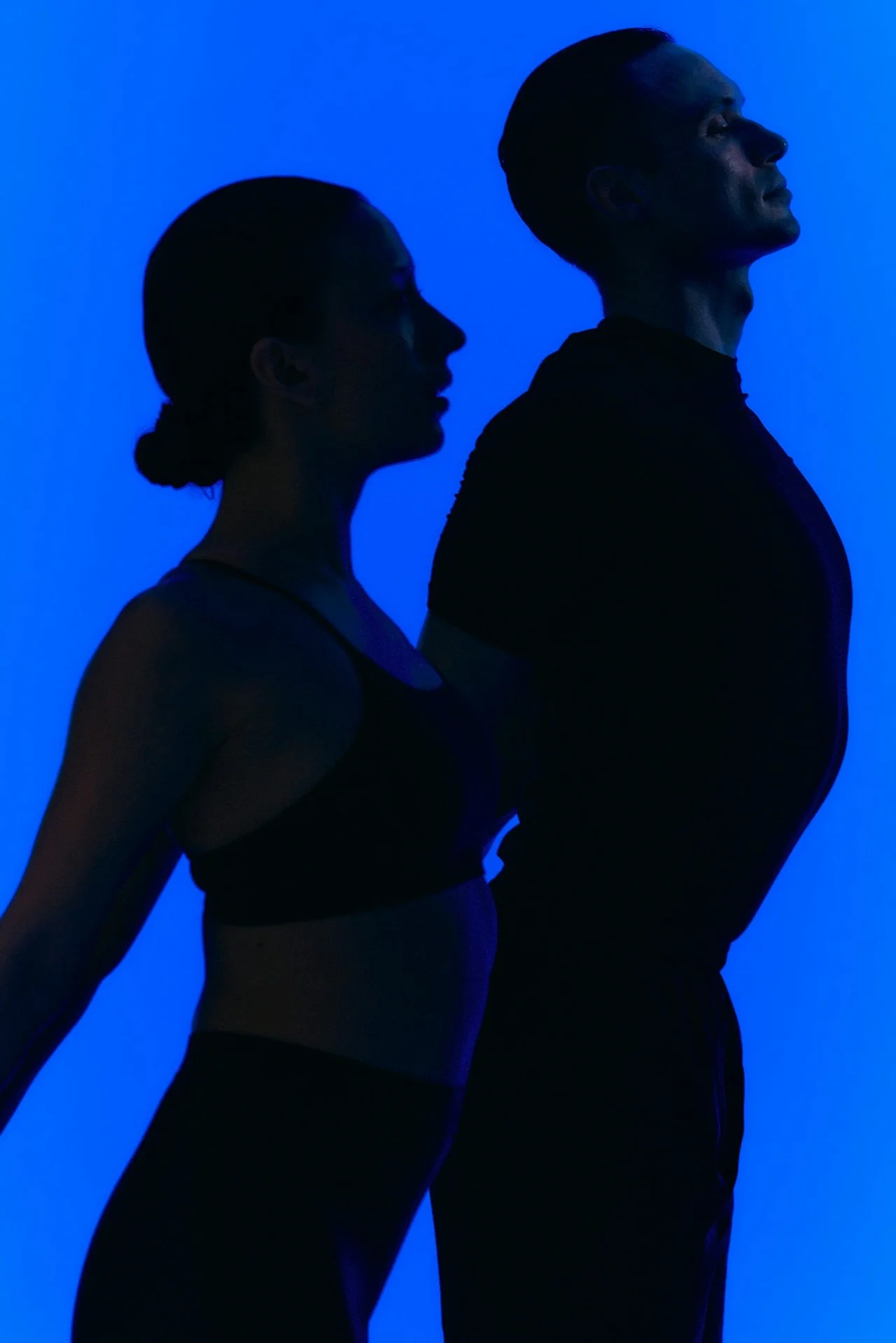 Athletes stretching in a blue glow