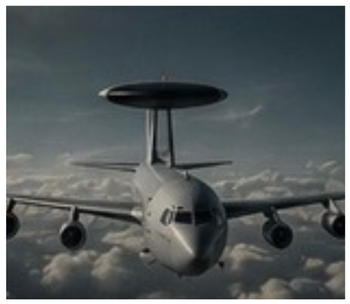 Military aircraft flying above clouds, featuring a large radar dome on top and four engines.