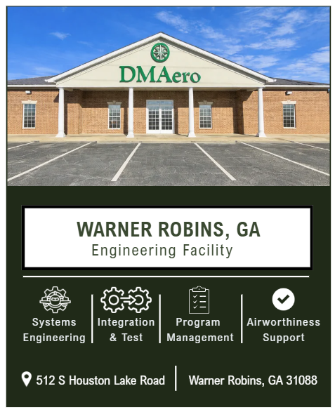 Sign for DMAero engineering facility in Warner Robins, Georgia, with clear blue sky in background.