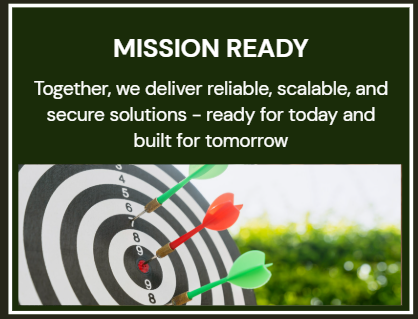 A sign with the words 'MISSION READY' and a message about delivering reliable, scalable, and secure solutions. The sign features a dartboard with three darts hitting the target.