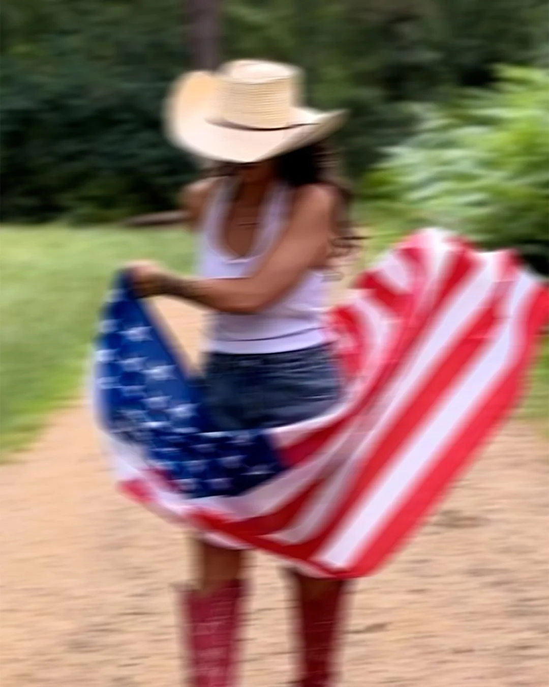 Lifestyle campaign image featuring The Prairie hat and an American flag inspired by long summer road trips.