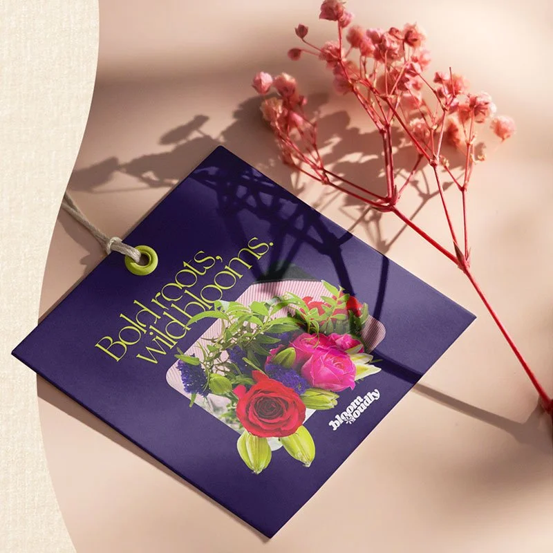 Gift tag designed for the Bloom Loudly brand concept, combining expressive typography with vibrant floral imagery.