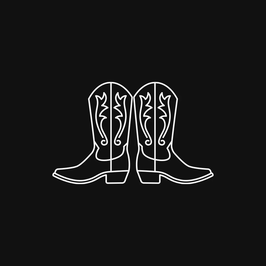 Neon outline of a pair of cowboy boots on a black background.