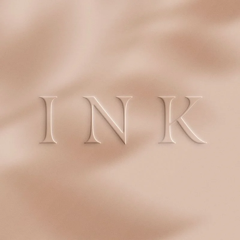Close-up of typography from the Natasha Carr brand identity, featuring an elegant serif wordmark designed by PMDN Creative.