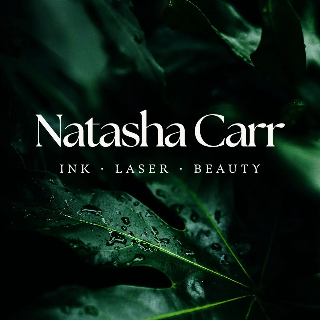 Business card for Natasha Carr, specializing in ink, laser, and beauty, with a dark green leafy background.