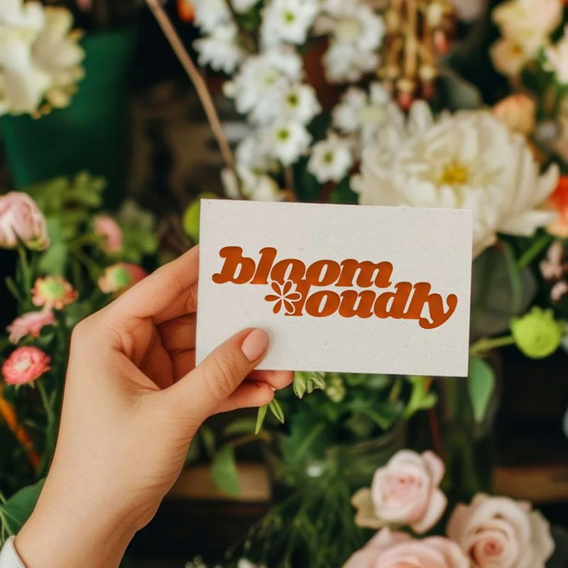 Business card created for the Bloom Loudly brand identity, featuring bold typography and expressive branding.